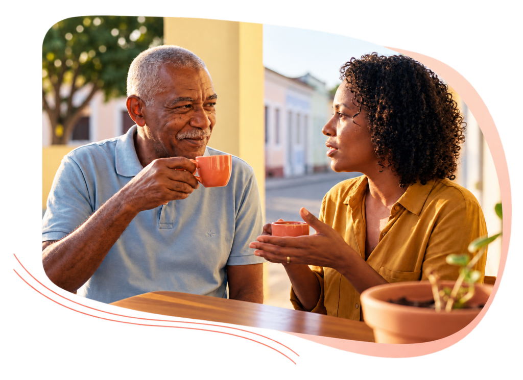 Homem e mulher conversam à mesa de café